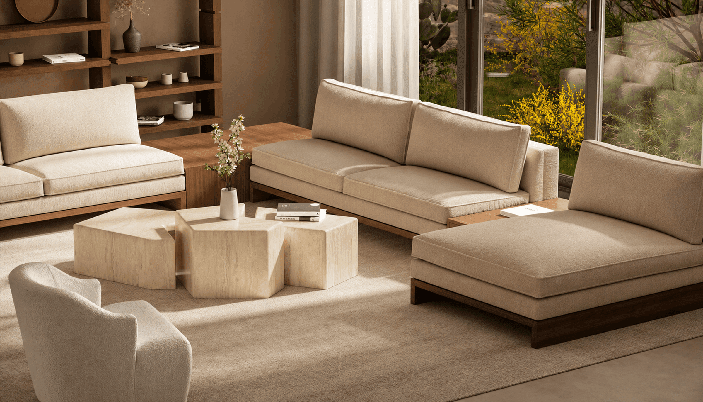 A living room in bouclé and walnut, opening onto a planted courtyard