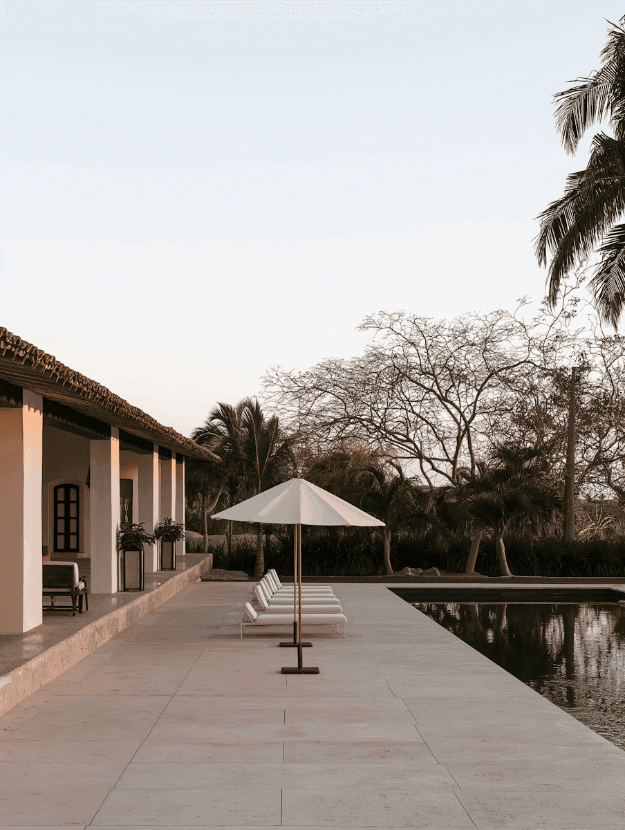 A shaded courtyard under a parasol