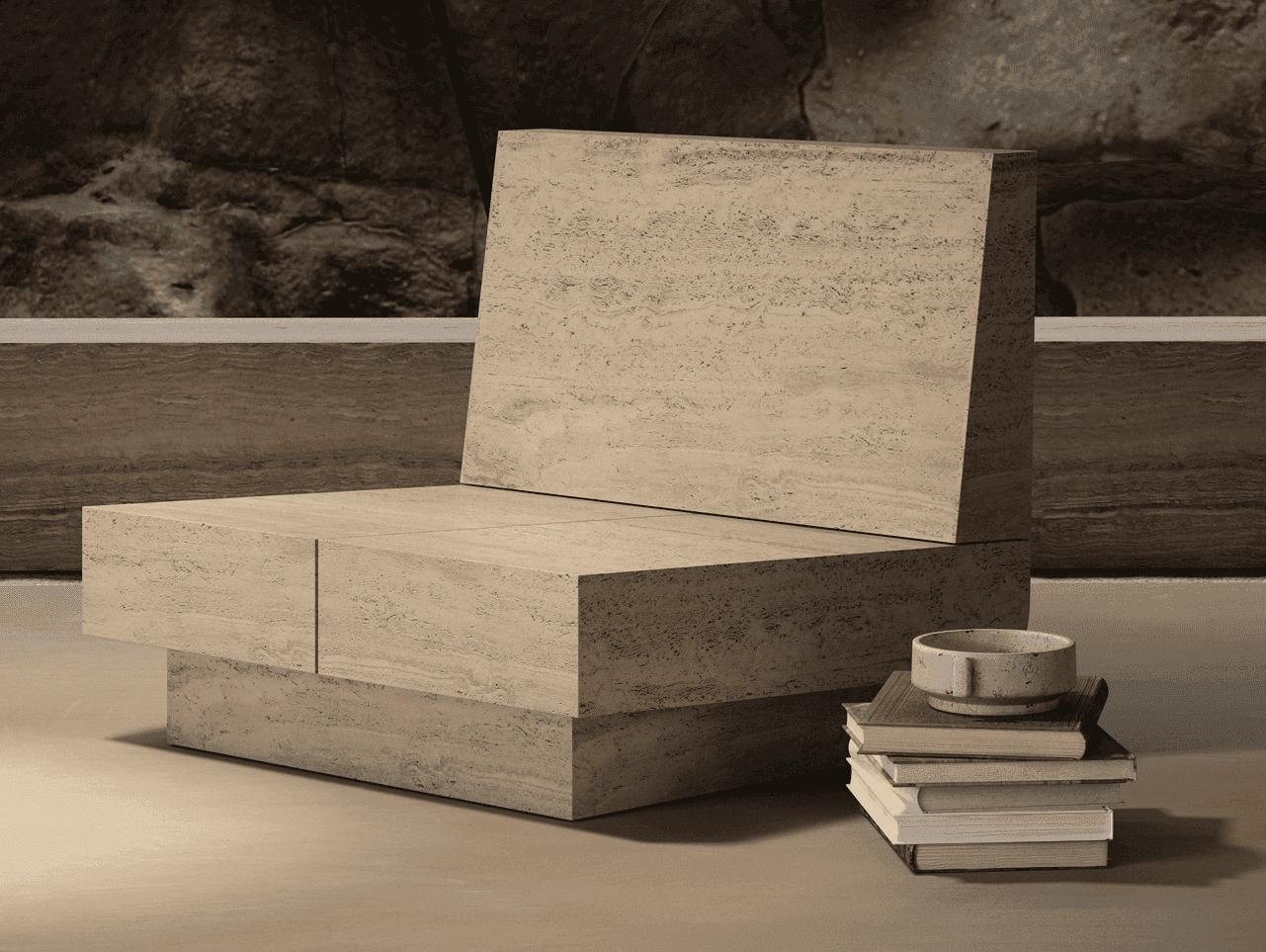 A travertine lounge chair with a stack of books